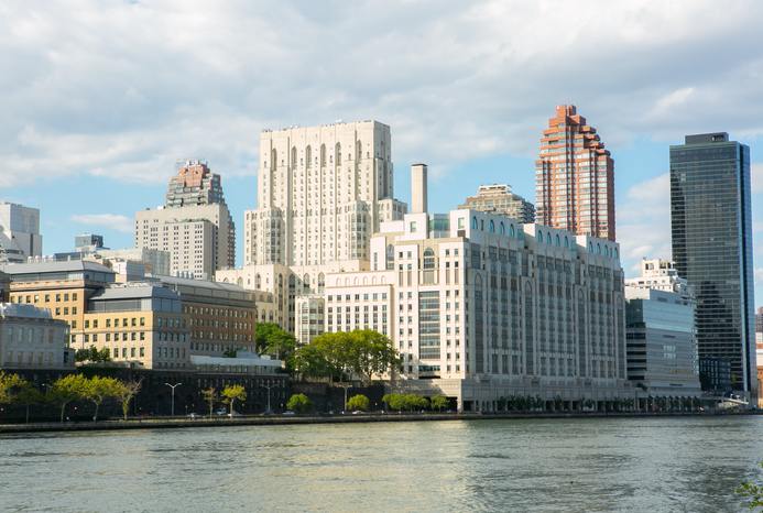 A city next to a body of water Description automatically generated with medium confidence