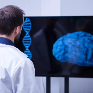 Neurosurgery USCE An image highlighting the Neurosurgery U.S. Clinical Experience (USCE) opportunities, showcasing a young brain surgeon examining a patient's brain post-surgery, using modern technology in a hospital setting.