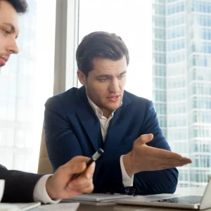 Residency Advising An image highlighting a residency advising session, showcasing an auditor explaining the results of an audit to a client, emphasizing the interactive and professional nature of the session.