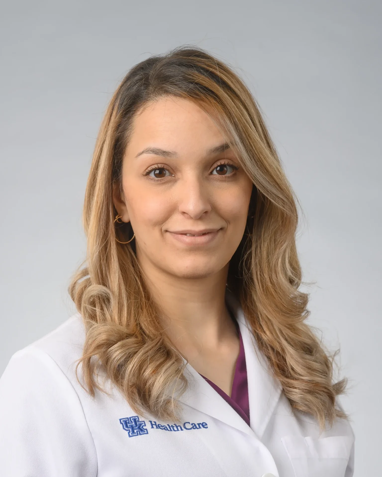Hafsa Nebbache, MD An image showcasing Hafsa Nebbache, MD, a PGY 3 Pathology Resident at the University of Kentucky, highlighting her professional journey and achievements.